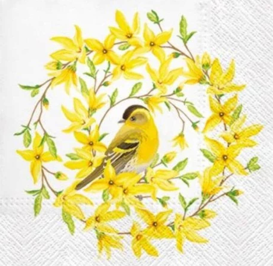a yellow bird sitting on top of a white napkin