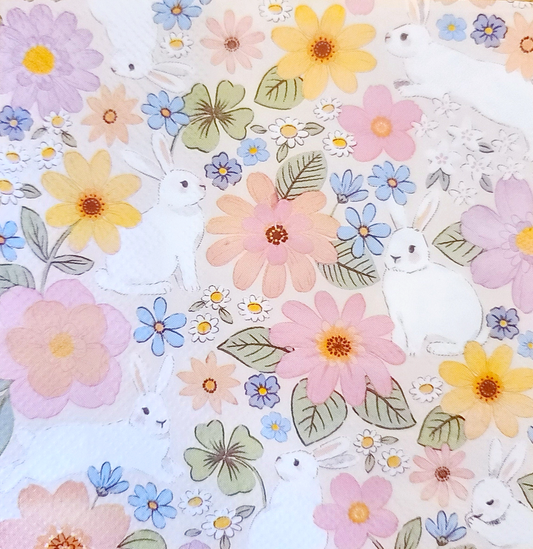 a close up of a quilt with flowers on it